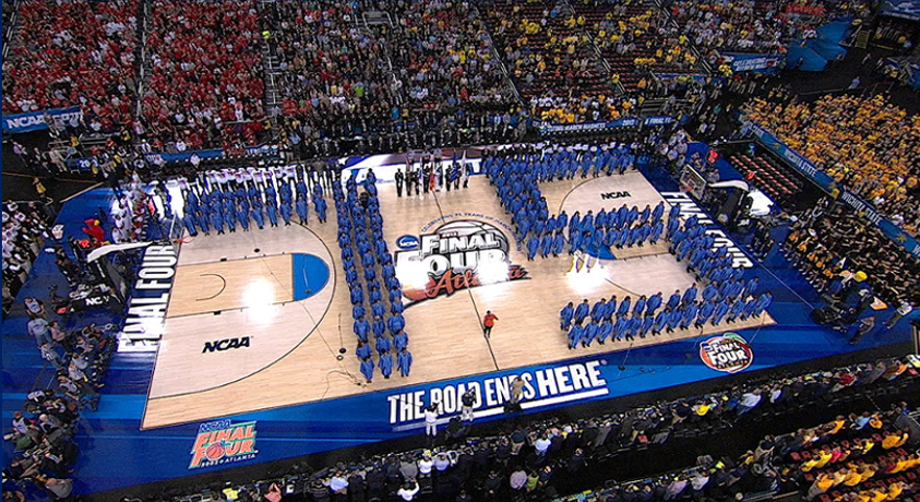 Marching band forms a giant 'NBA Finals' logo on court.